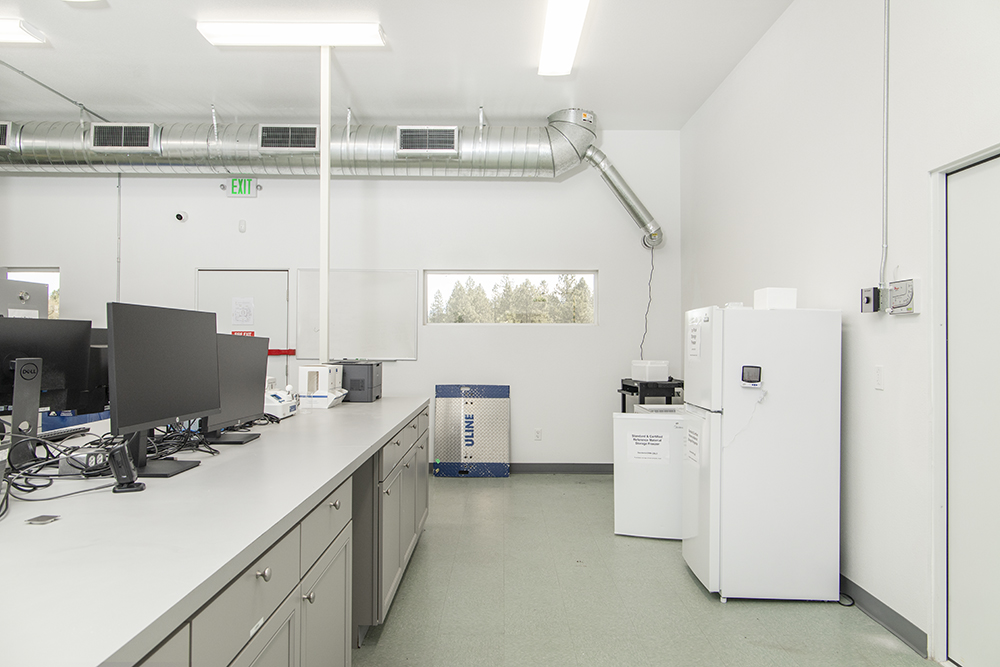 Separate enclosed room with HVAC, ventilation, and power access — suitable for lab work, processing, or clean storage.