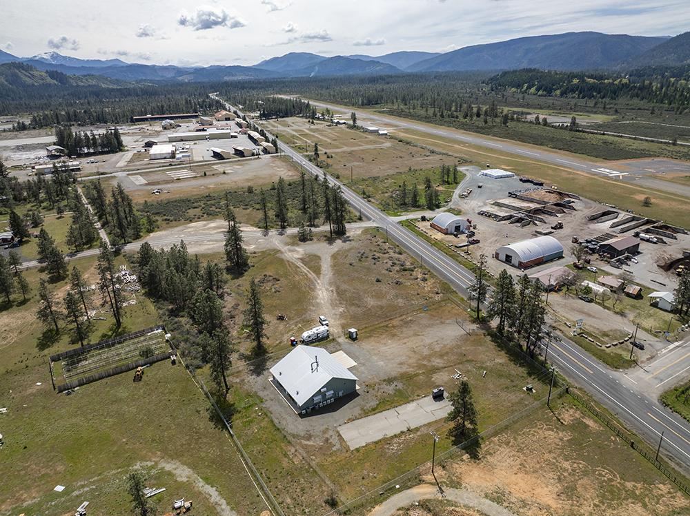 Aerial view showing 30073 Redwood Hwy with direct frontage on Highway 199, highlighting road visibility and commercial access.
