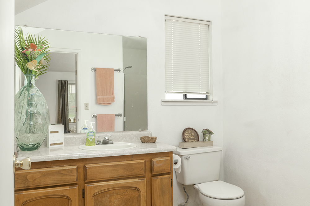 Main-level bathroom with walk-in shower and modern fixtures.